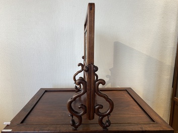 A Chinese famille verte plaque set in a partly huanghuali wooden table screen, Kangxi