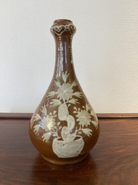 A Chinese slip-decorated brown-ground bottle vase, Zhushan kilns, late Ming