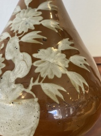 A Chinese slip-decorated brown-ground bottle vase, Zhushan kilns, late Ming