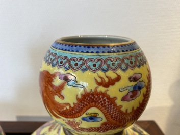 A pair of Chinese famille rose yellow-ground 'dragon' vases, Qianlong mark, 20th C.