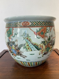 A Chinese famille verte fish bowl with warriors on horseback, 19th C.