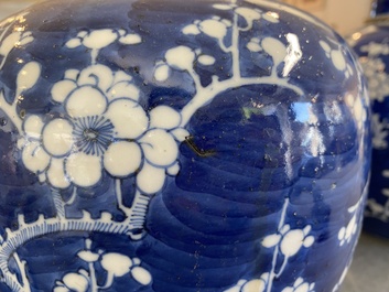 A pair of Chinese blue and white jars and covers, 19th C.