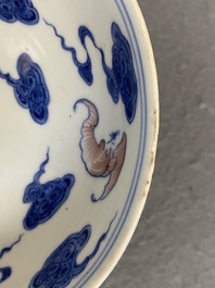 A Chinese blue, white and copper-red 'Bats and clouds' plate, Qianlong mark but probably later
