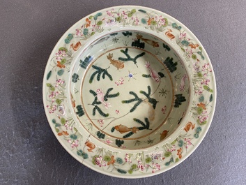 A Chinese famille rose celadon-ground 'carps' basin, 19th C.