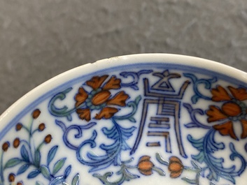 A Chinese doucai 'phoenix' saucer, Jiaqing mark, 19th C.