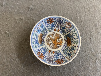 A Chinese doucai 'phoenix' saucer, Jiaqing mark, 19th C.