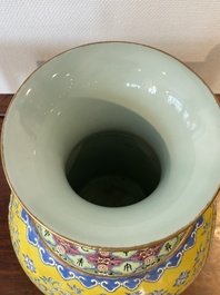 A Chinese reticulated and revolving famille rose vase consisting of two parts, Qianlong mark, 20th C.