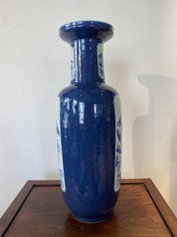 A Chinese blue-ground rouleau vase with blue and white landscape panels, 19th C.