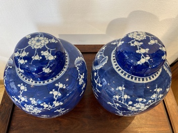 A pair of Chinese blue and white jars and covers, 19th C.