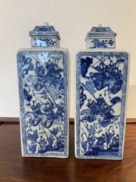 A pair of Chinese blue and white square 'narrative subject' vases and covers, Kangxi