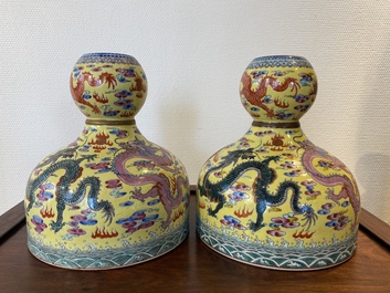 A pair of Chinese famille rose yellow-ground 'dragon' vases, Qianlong mark, 20th C.