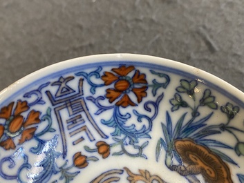 A Chinese doucai 'phoenix' saucer, Jiaqing mark, 19th C.
