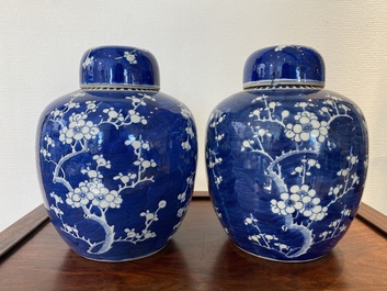 A pair of Chinese blue and white jars and covers, 19th C.