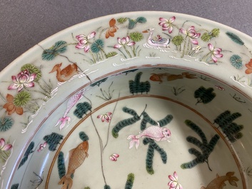 A Chinese famille rose celadon-ground 'carps' basin, 19th C.