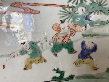 A Chinese famille verte plaque set in a partly huanghuali wooden table screen, Kangxi