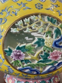 A Chinese reticulated and revolving famille rose vase consisting of two parts, Qianlong mark, 20th C.