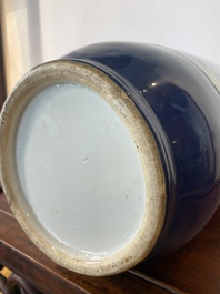 A Chinese blue-ground rouleau vase with blue and white landscape panels, 19th C.