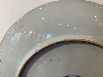 A Chinese blue and white 'peony scroll' dish and a famille verte dish, Kangxi