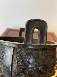 A Chinese bronze tripod censer with 'taotie' masks, Ming