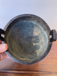 A Chinese bronze tripod censer with 'taotie' masks, Ming
