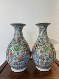 A pair of Chinese famille rose vases with elephant handles, 19th C.