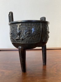 A Chinese bronze tripod censer with 'taotie' masks, Ming