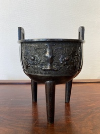 A Chinese bronze tripod censer with 'taotie' masks, Ming