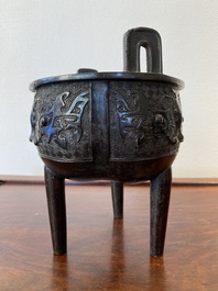 A Chinese bronze tripod censer with 'taotie' masks, Ming