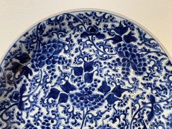 A Chinese blue and white 'peony scroll' dish and a famille verte dish, Kangxi