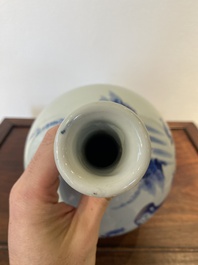 A Japanese blue and white bottle vase with a lady in a landscape, Edo, 17/18th C.