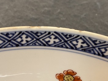 A Chinese blue and white 'peony scroll' dish and a famille verte dish, Kangxi