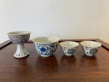 Un bol sur piedouche en porcelaine de Chine famille rose, un bol en bleu et blanc et une paire en doucai, Yongzheng et post&eacute;rieur