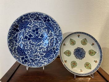A Chinese blue and white 'peony scroll' dish and a famille verte dish, Kangxi