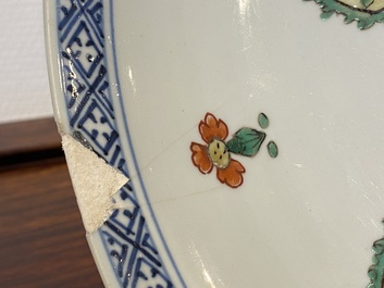 A Chinese blue and white 'peony scroll' dish and a famille verte dish, Kangxi
