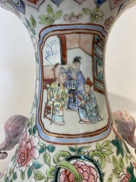 A pair of Chinese famille rose vases with elephant handles, 19th C.