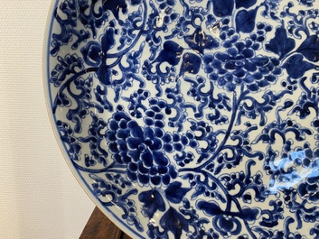 A Chinese blue and white 'peony scroll' dish and a famille verte dish, Kangxi