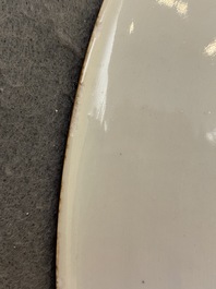 A Chinese blue and white 'peony scroll' dish and a famille verte dish, Kangxi