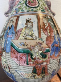 A pair of Chinese famille rose vases with elephant handles, 19th C.