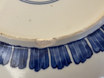A Chinese blue and white 'peony scroll' dish and a famille verte dish, Kangxi