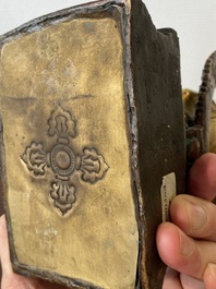 A Sino-Tibetan gilt and silvered copper alloy Medicine Buddha or Bhaishajyaguru, 19th C.