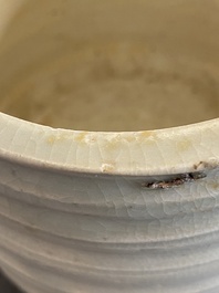 A Chinese qingbai wall pocket vase and a three-legged incense burner, Song