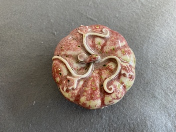 A Chinese peachbloom-glazed pumpkin-shaped box and cover, 19th C.