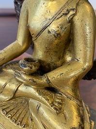 A Sino-Tibetan gilt and silvered copper alloy Medicine Buddha or Bhaishajyaguru, 19th C.