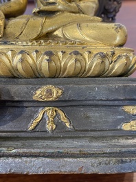 A Sino-Tibetan gilt and silvered copper alloy Medicine Buddha or Bhaishajyaguru, 19th C.
