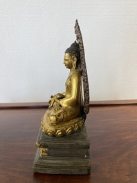 A Sino-Tibetan gilt and silvered copper alloy Medicine Buddha or Bhaishajyaguru, 19th C.