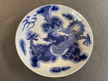 A Chinese blue and white plate with a dragon chasing the flaming pearl, Yongzheng mark and of the period