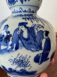 A Chinese blue and white double gourd vase with a scholar and two students, Transitional period