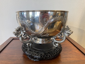 A large Chinese silver bowl resting on three dragon feet, marked for Kun He, Shanghai, 19/20th C.