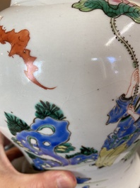 A Chinese famille rose 'playing boys' vase on a fine carved wooden stand, Yongzheng