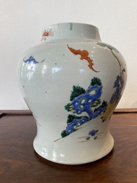 A Chinese famille rose 'playing boys' vase on a fine carved wooden stand, Yongzheng